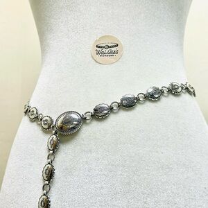 Silver tone western belt with silver tone buckle